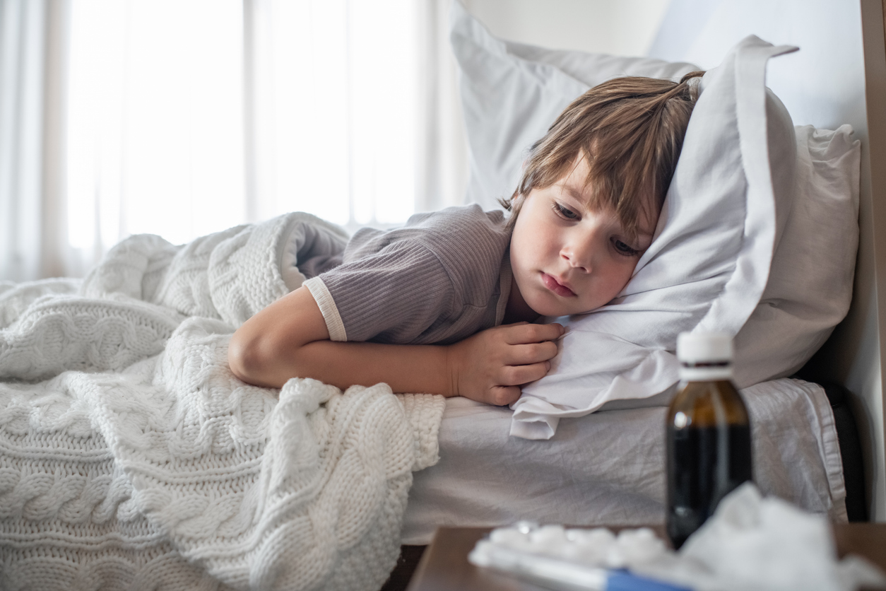 Little boy ill at home with a virus or infectious disease